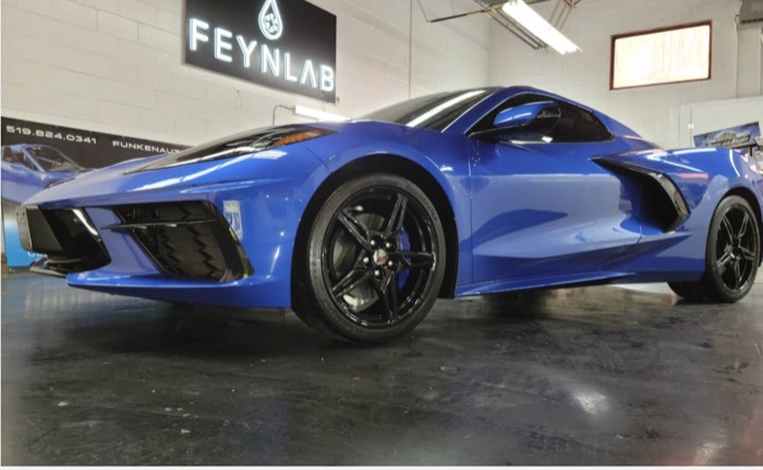 Blue Chevrolet Corvette C8 Stingray under the Feynlab sign at Funken Auto Spa, Guelph, Ontario
