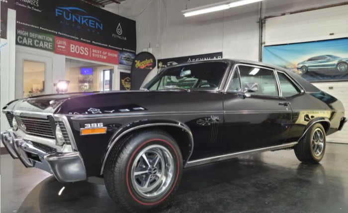 Black Chevrolet Nova SS 396 reflecting the shop banners at Funken Auto Spa, Guelph, Ontario