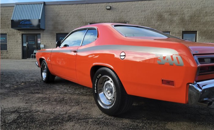 Orange Plymouth Duster 340 outside the Funken Auto Spa shop on Woodlawn Road West, Guelph